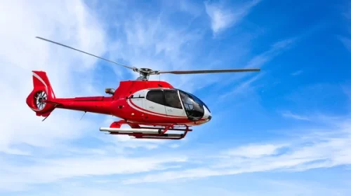 depositphotos_153970538-stock-photo-helicopter-in-flight